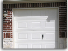 Accent Garage Doors has replaced the two bottom garage panels to repair this door